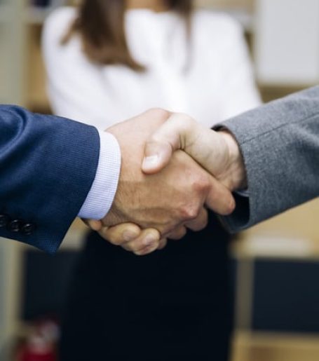 businessmen-handshaking-after-deal-agreement-2022-04-22-04-25-23-utc-1.jpg